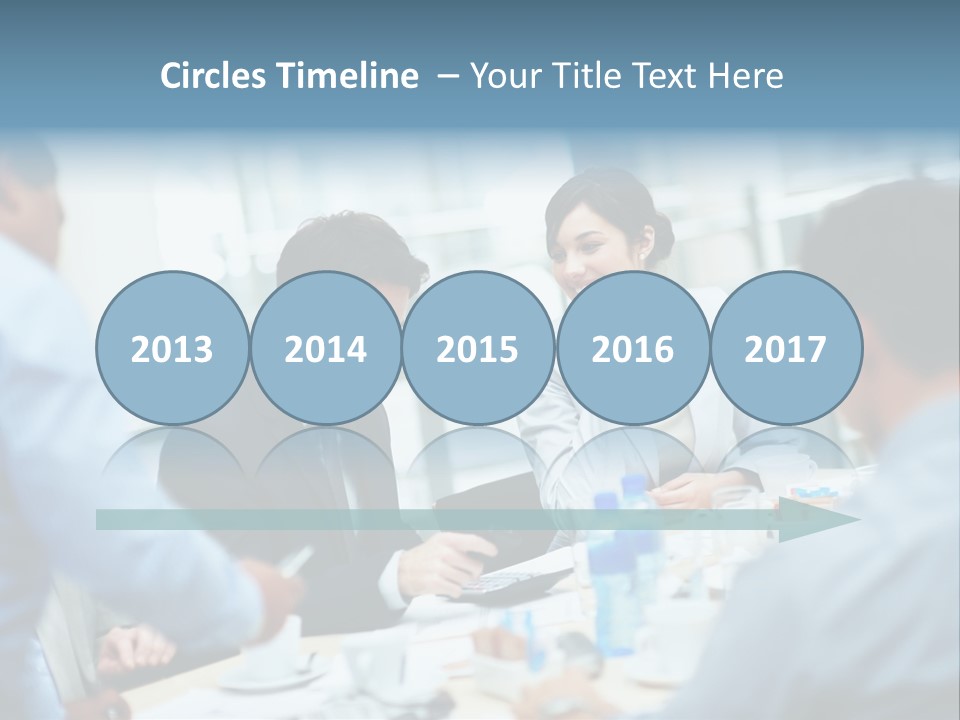 A Group Of Business People Sitting Around A Table PowerPoint Template