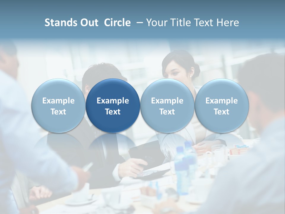 A Group Of Business People Sitting Around A Table PowerPoint Template