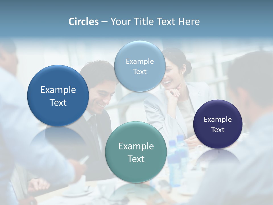 A Group Of Business People Sitting Around A Table PowerPoint Template