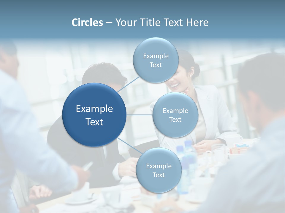 A Group Of Business People Sitting Around A Table PowerPoint Template