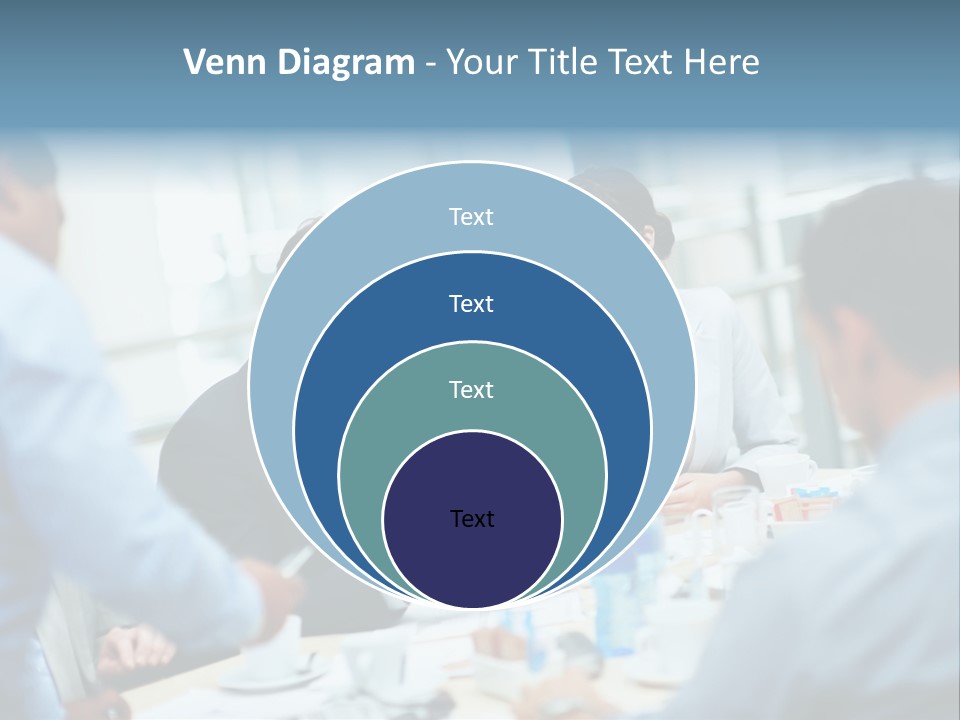 A Group Of Business People Sitting Around A Table PowerPoint Template
