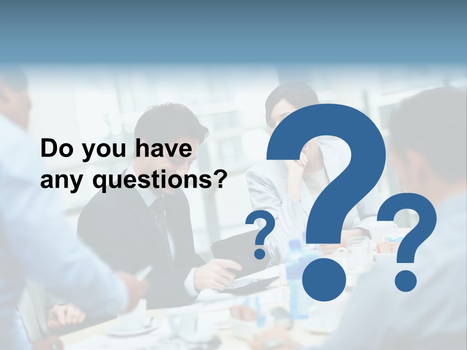 A Group Of Business People Sitting Around A Table PowerPoint Template