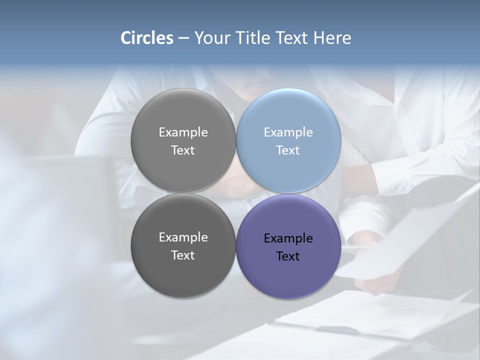 A Man And A Woman Sitting At A Table Looking At A Computer Screen PowerPoint Template