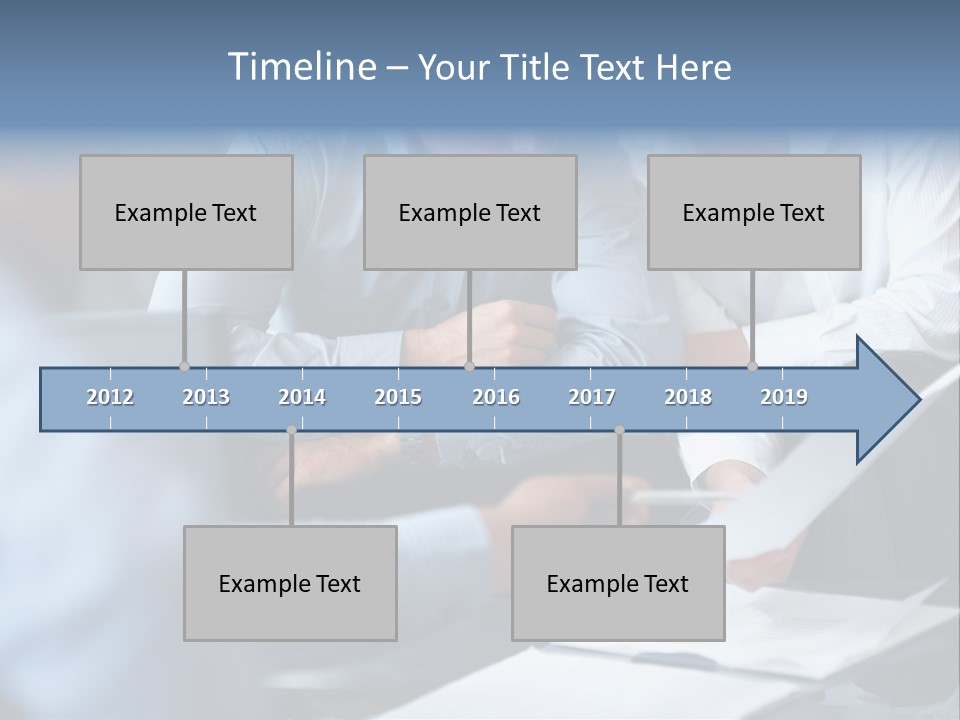 A Man And A Woman Sitting At A Table Looking At A Computer Screen PowerPoint Template