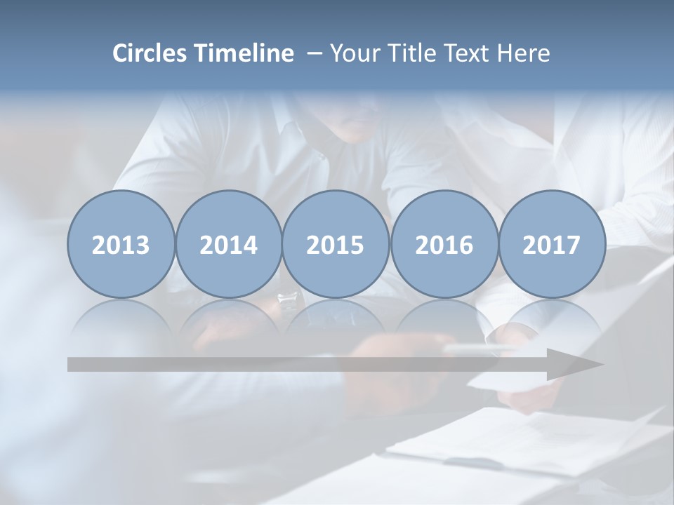 A Man And A Woman Sitting At A Table Looking At A Computer Screen PowerPoint Template