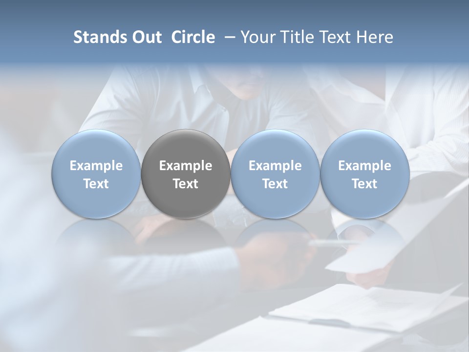 A Man And A Woman Sitting At A Table Looking At A Computer Screen PowerPoint Template