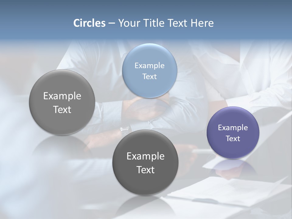 A Man And A Woman Sitting At A Table Looking At A Computer Screen PowerPoint Template