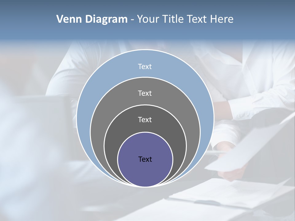 A Man And A Woman Sitting At A Table Looking At A Computer Screen PowerPoint Template