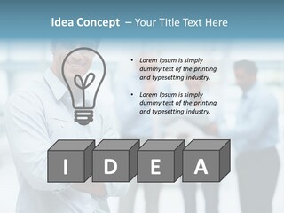 A Man Standing In Front Of A Group Of People PowerPoint Template