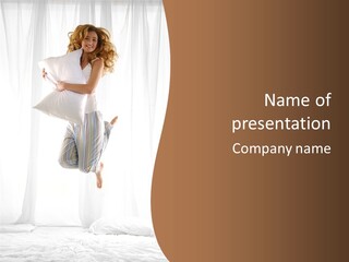 A Woman Jumping In The Air With A Pillow PowerPoint Template