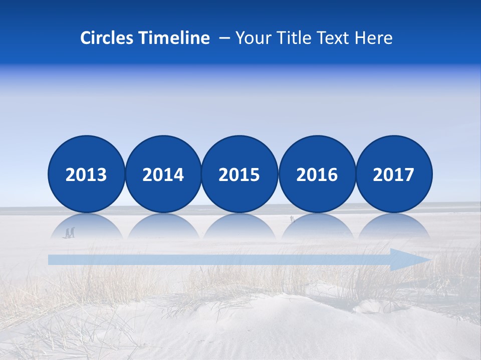 A Sandy Beach With A Person Walking On It PowerPoint Template