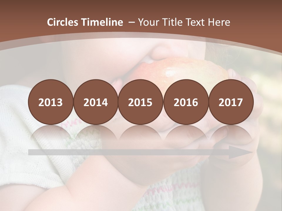 A Little Girl Holding An Apple In Her Hands PowerPoint Template