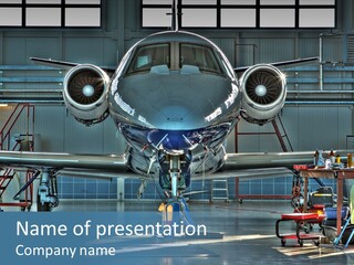 A Plane Is Parked Inside Of A Hangar PowerPoint Template
