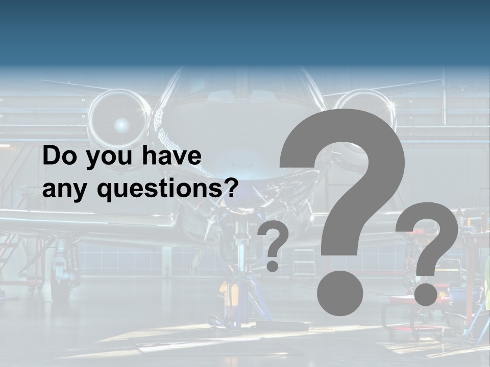 A Plane Is Parked Inside Of A Hangar PowerPoint Template
