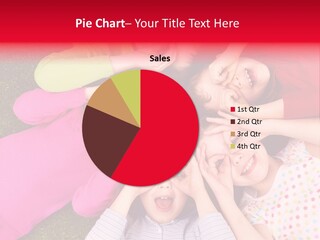 A Group Of Children Laying In A Circle On The Grass PowerPoint Template