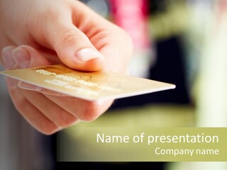 A Person Holding A Credit Card In Their Hand PowerPoint Template