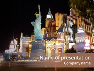 The Statue Of Liberty Is Lit Up At Night PowerPoint Template