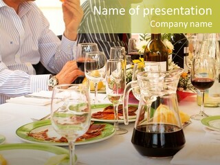 A Group Of People Sitting At A Table With Wine Glasses PowerPoint Template