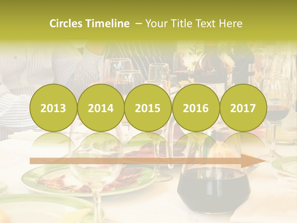 A Group Of People Sitting At A Table With Wine Glasses PowerPoint Template
