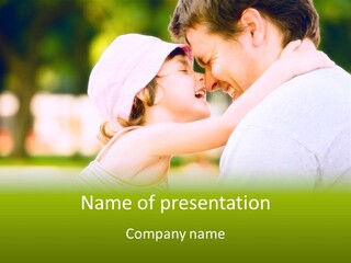 A Man Holding A Little Girl In His Arms PowerPoint Template