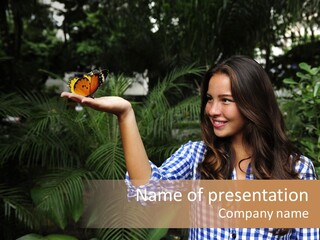 A Woman Holding A Butterfly In Her Hand PowerPoint Template