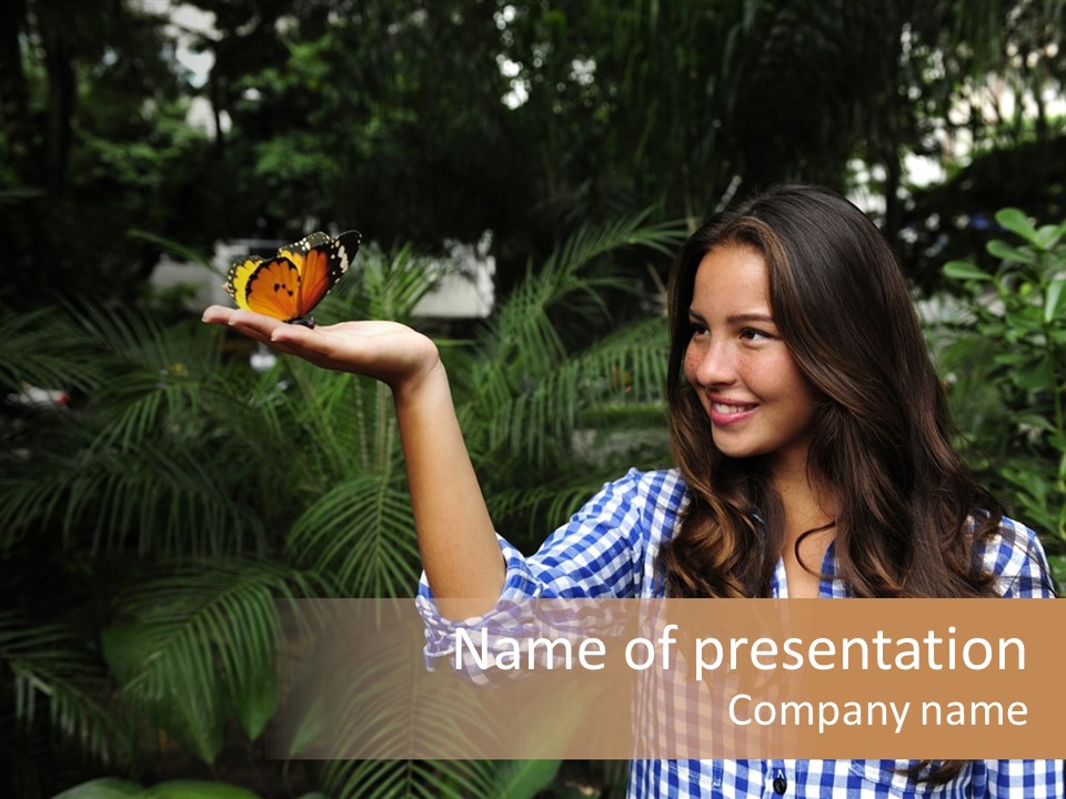 A Woman Holding A Butterfly In Her Hand PowerPoint Template
