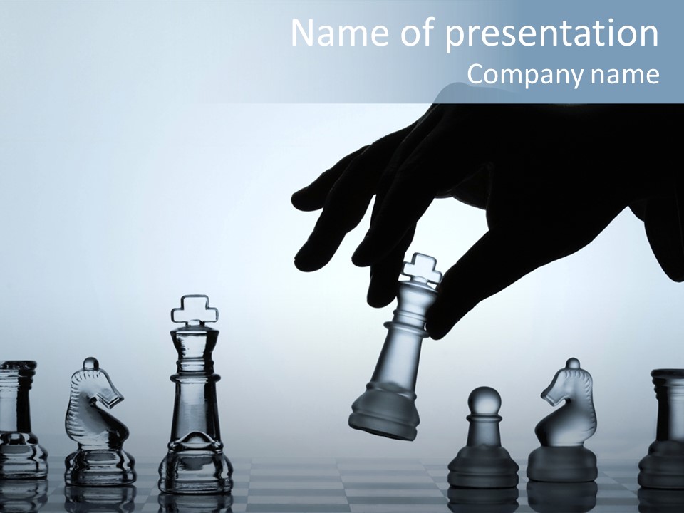 A Hand Is Pushing A Chess Piece On A Chess Board PowerPoint Template