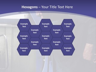 A Man Standing Next To A Machine In A Factory PowerPoint Template