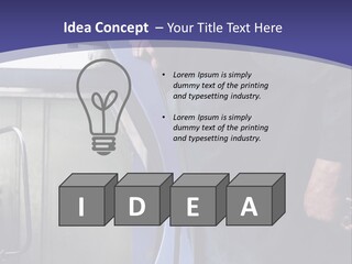 A Man Standing Next To A Machine In A Factory PowerPoint Template