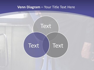 A Man Standing Next To A Machine In A Factory PowerPoint Template