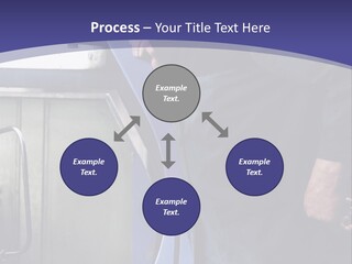 A Man Standing Next To A Machine In A Factory PowerPoint Template