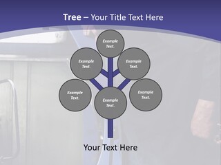 A Man Standing Next To A Machine In A Factory PowerPoint Template