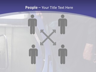 A Man Standing Next To A Machine In A Factory PowerPoint Template