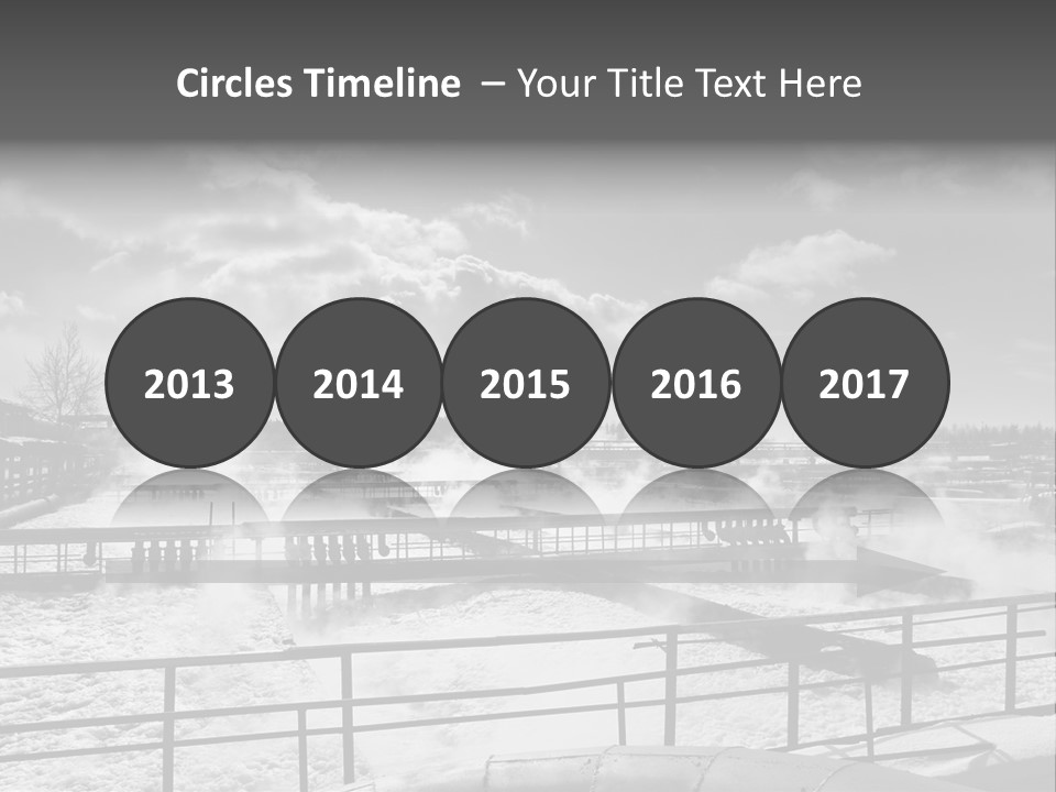 A Black And White Photo Of A Factory With Steam Coming Out Of It PowerPoint Template