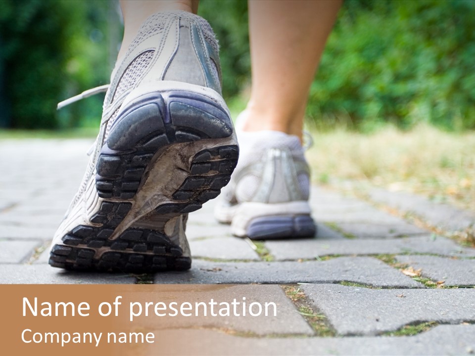 A Person Walking Down A Sidewalk With Their Shoes On PowerPoint Template