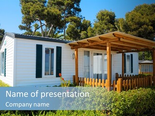 A Small White House With Green Shutters On A Sunny Day PowerPoint Template