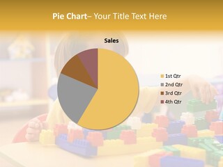 A Little Girl Playing With Legos At A Table PowerPoint Template