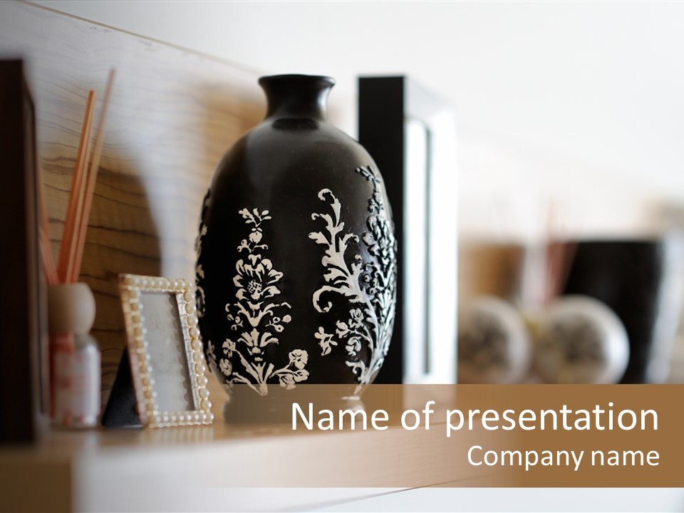 A Black Vase Sitting On Top Of A Shelf PowerPoint Template