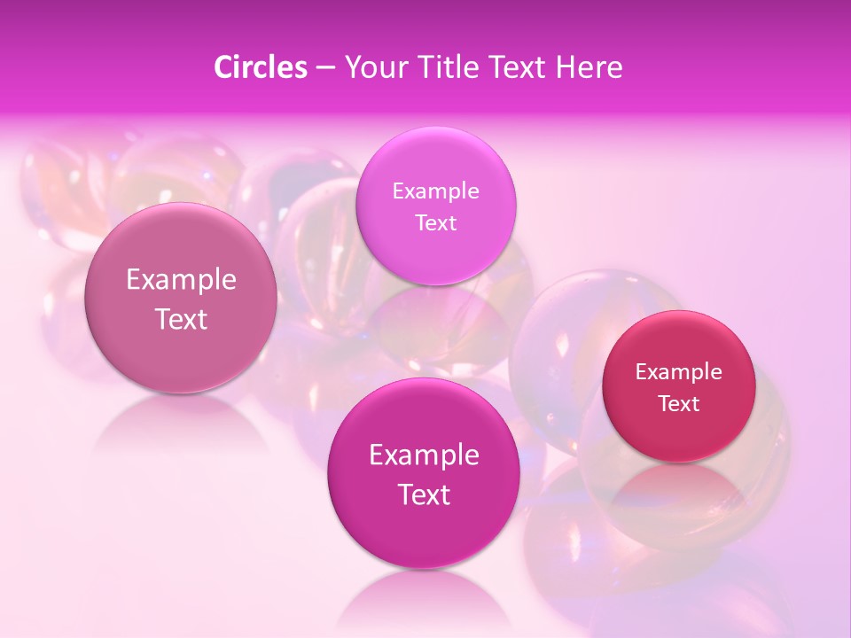 A Row Of Colorful Glass Balls On A White Surface PowerPoint Template
