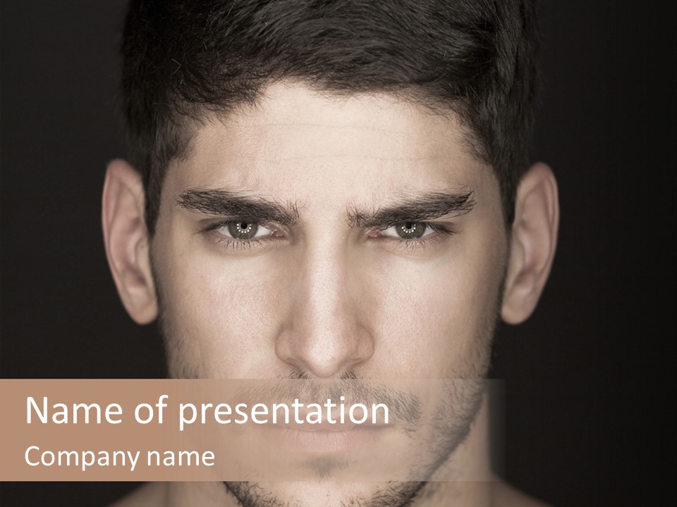 A Man With A Beard Is Looking At The Camera PowerPoint Template