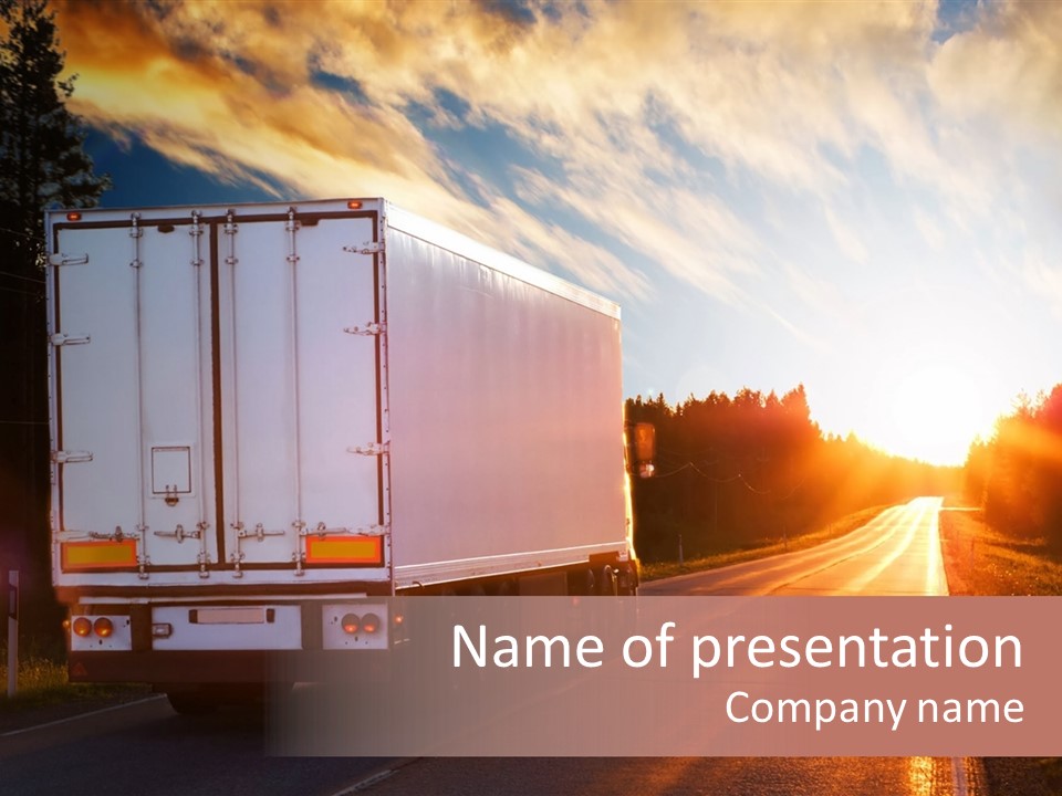 A Semi Truck Driving Down A Rural Road At Sunset PowerPoint Template