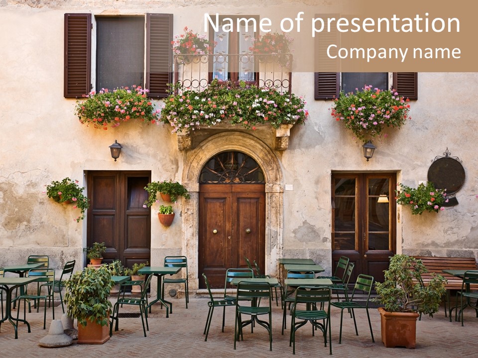 A Building With Tables And Chairs Outside Of It PowerPoint Template