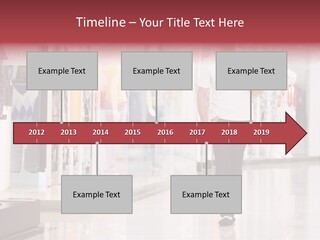 A Man Walking Down A Shopping Mall Holding A Shopping Bag PowerPoint Template