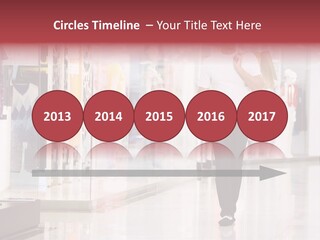 A Man Walking Down A Shopping Mall Holding A Shopping Bag PowerPoint Template