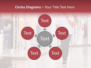 A Man Walking Down A Shopping Mall Holding A Shopping Bag PowerPoint Template