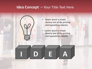 A Man Walking Down A Shopping Mall Holding A Shopping Bag PowerPoint Template