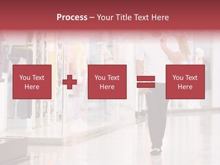 A Man Walking Down A Shopping Mall Holding A Shopping Bag PowerPoint Template