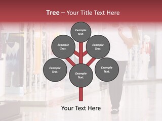A Man Walking Down A Shopping Mall Holding A Shopping Bag PowerPoint Template