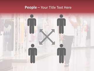 A Man Walking Down A Shopping Mall Holding A Shopping Bag PowerPoint Template