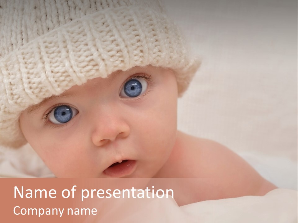A Baby Wearing A White Knitted Hat With Blue Eyes PowerPoint Template